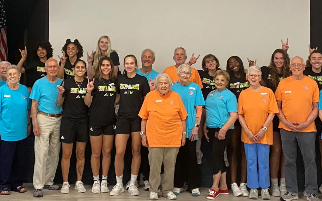 Unisen Senior Living joins USF women’s basketball team in cornhole tournament