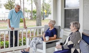 Seniors sitting & conversing on front porch